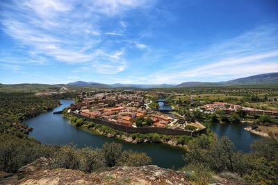 Aerial view of bridge over river against sky