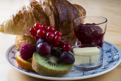 Close-up of fresh fruits in plate on table