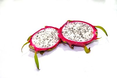 Close-up of strawberry over white background