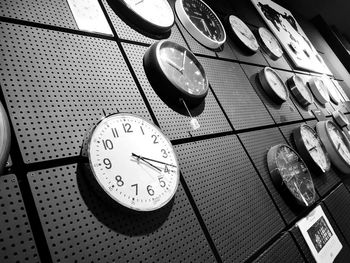 Low angle view of clock on wall