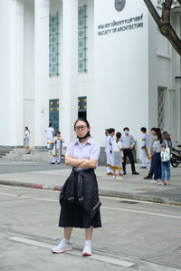 Full length of woman standing on street