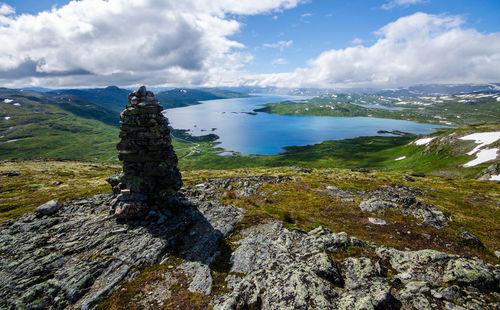 Scenic view of sea and mountains against sky