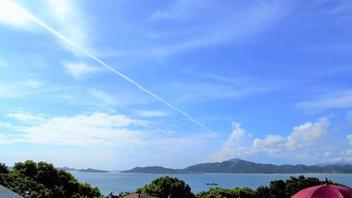 Scenic view of lake against blue sky