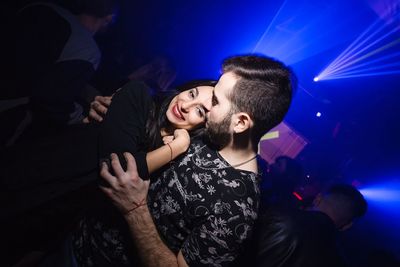 Young couple looking at music concert