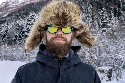 Portrait of man wearing sunglasses during winter