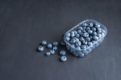 High angle view of fruits in container on table