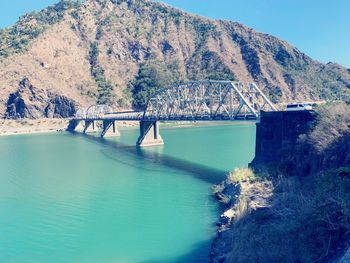 Bridge over river against sky