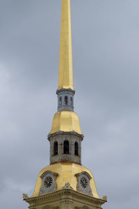 Low angle view of bell tower against sky