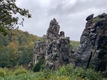 Low angle view of rocks against sky