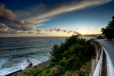 Scenic view of sea against sky at sunset