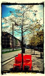 Red umbrella against sky