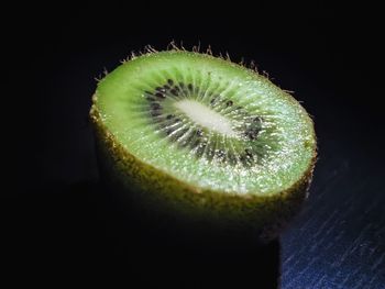 Close-up of lemon slice over black background