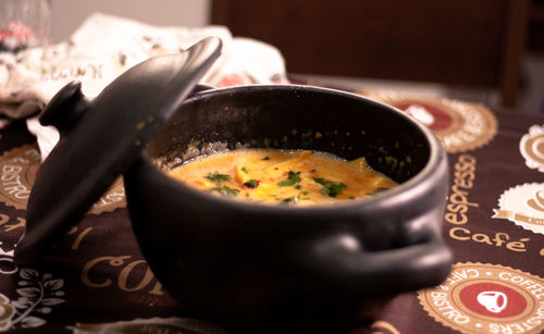 Close-up of soup served on table