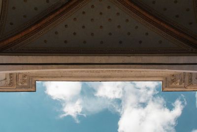 Low angle view of building against cloudy sky