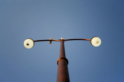 Low angle view of street light against clear sky