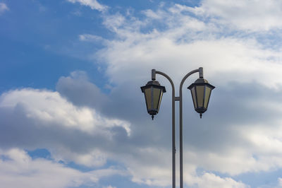 Low angle view of street light against sky