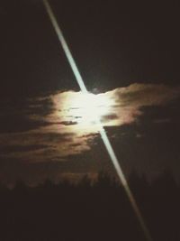 Close-up of vapor trails in sky at night