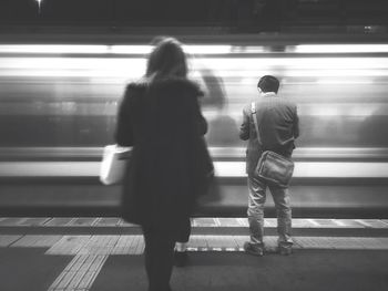 Blurred motion of woman in subway