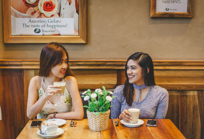 Young woman sitting in restaurant