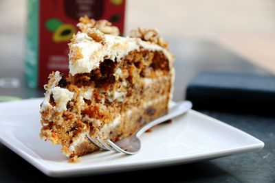 Close-up of carrot cake in plate on table