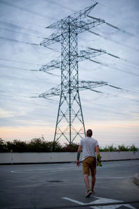 A boy skateboarding in hand