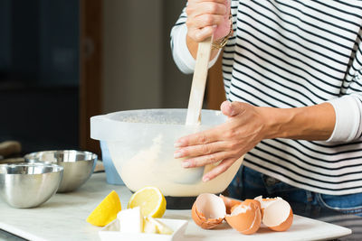 Midsection of man preparing food on table