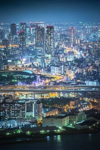 High angle view of illuminated buildings in city at night