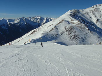 Scenic view of snowcapped mountain against clear sky