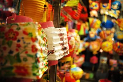 Colorful lanterns hanging in store