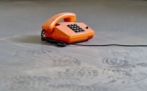 Close-up of vintage phone on floor
