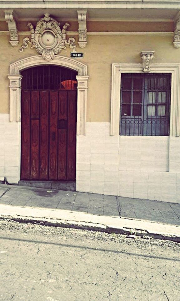 CLOSED DOOR OF BUILDING WITH WINDOWS