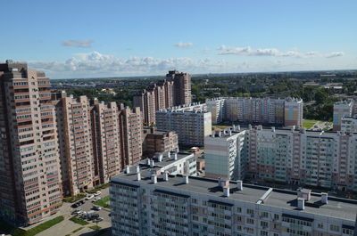 High angle view of buildings in city against sky