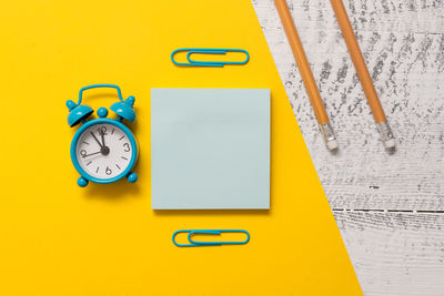 Directly above shot of clock on table