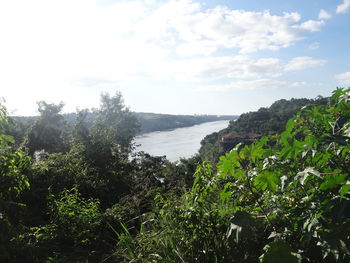 Scenic view of sea against cloudy sky