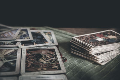 Close-up of old objects on table against black background