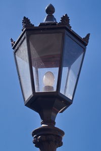 Low angle view of statue against clear blue sky