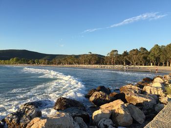 Scenic view of sea against blue sky