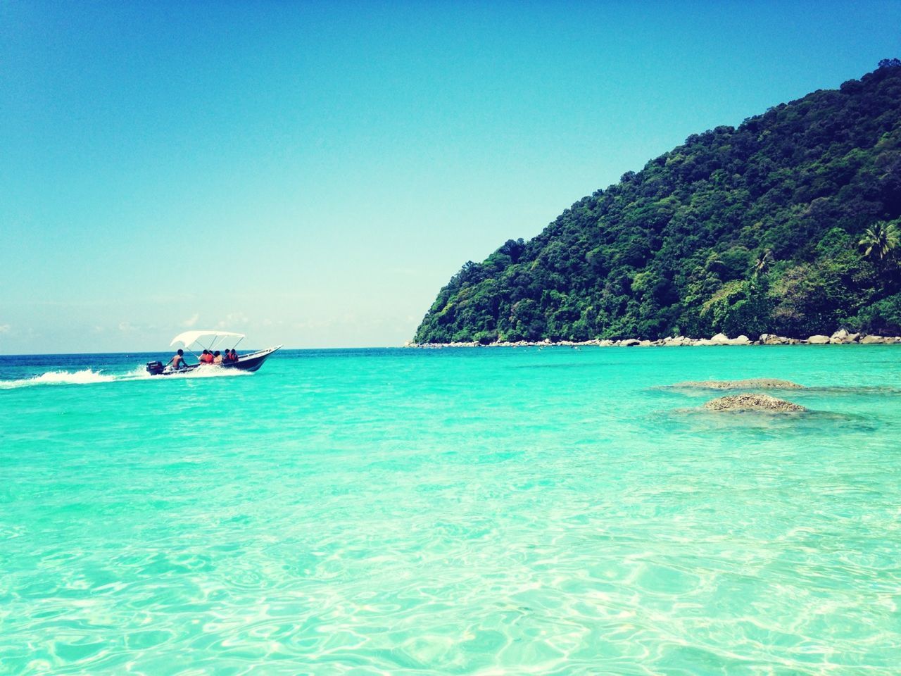 water, sea, blue, nautical vessel, clear sky, transportation, waterfront, boat, mode of transport, scenics, tranquil scene, beauty in nature, tranquility, nature, copy space, mountain, horizon over water, rippled, turquoise colored, idyllic