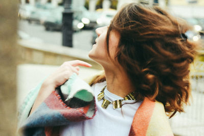 Close-up of young woman holding hands