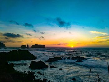 Scenic view of sea against sky during sunset