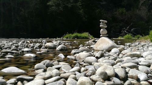 Pebble on pebbles in water