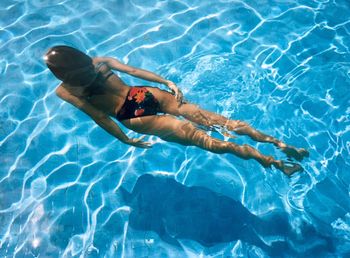 High angle view of woman swimming in pool