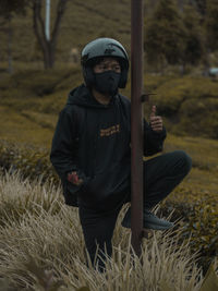 Full length of man standing on field