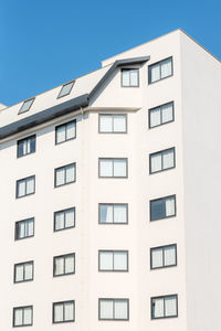 Close-up of the facade of a white building with windows. hospital building.