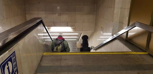 People on escalator in subway station