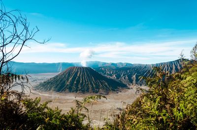 Scenic view of landscape against cloudy sky