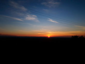 Scenic view of silhouette landscape against sky during sunset