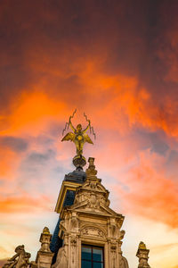 Low angle view of statue against sky during sunset