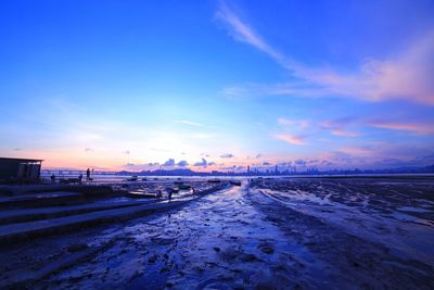 Scenic view of river against sky during sunset