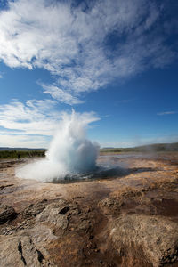 View of beach against cloudy sky